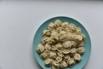 Cooked dumplings on a plate in the kitchen