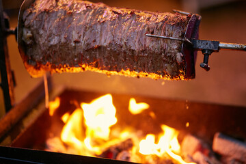shawarma, lamb on a spit. street food. Doner Kebab on a rotating spit. A street food of Turkey. Gyros, doner grilled slowly on rotating spits.