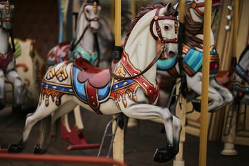 Retro carousel white, black horse. Old wooden horse carousel. Carousel! Horses on vintage, retro...