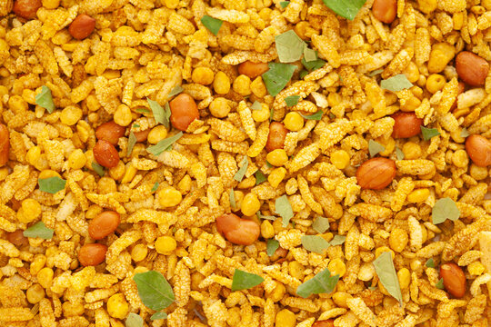 Crunchy Diet Mixture full-frame wallpaper, made with Puffed Rice, Corn Flakes, and Curry leaves. Indian spicy snacks (Namkeen)