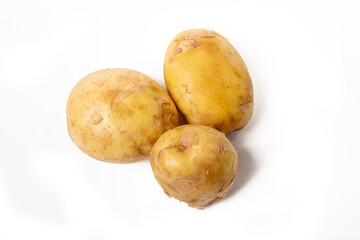 the background is white. yellow potatoes. a few pieces. close-up