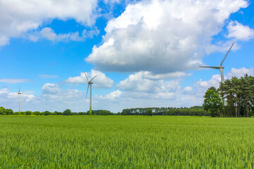 North German agricultural field wind turbines nature landscape panorama Germany.