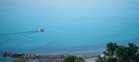 Boat in the sea carefully composed shot near Afitos, Greece