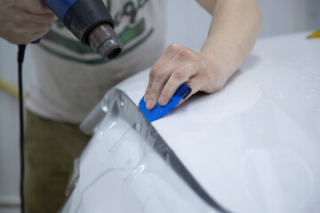 Installation of a protective film on the car body.Protection of the paintwork.