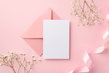 Wedding invitation concept. Top view photo of pink envelope paper card pink curly ribbon and white...