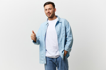 Cheerful happy tanned handsome man in casual basic t-shirt show thumb up gesture Like posing isolated on over white studio background. Copy space Banner Mockup. Lifestyle People emotions concept