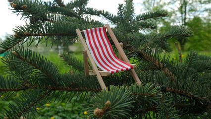 Chaise lounge chair with red stripes for relaxing.