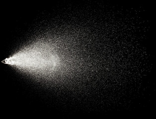 Sprayed water. Splashes and drops of water isolated on black background.