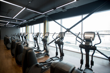 Obraz premium Sport gym interior with treadmill equipment in the morning
