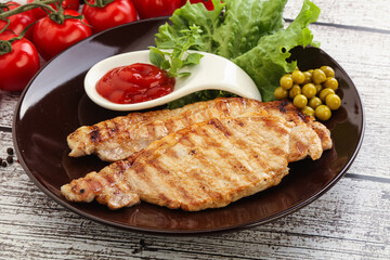 Grilled pork steak with ketchup