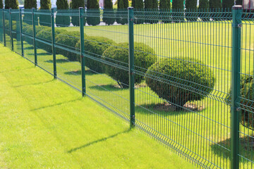 neat fence and trimmed lawn on private property