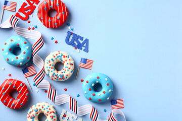 Happy Independence Day USA banner mockup. Flat lay donuts in American flag colors, ribbon, decorations on blue background. 4th of July greeting card design.