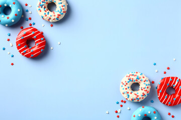 USA Independence Day banner design. Flat lay donuts in American flag colors on blue background. 4th...
