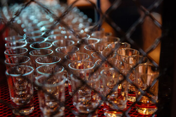 Empty glass glasses in a nightclub in the twilight