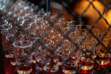 Empty glass glasses in a nightclub in the twilight