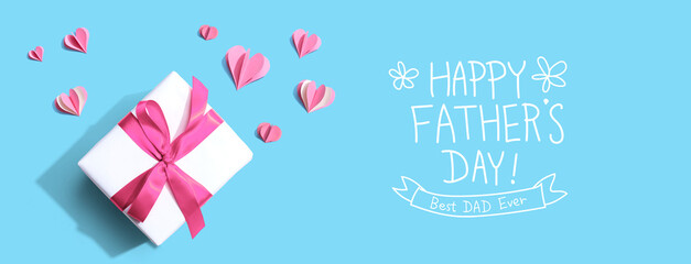 Happy fathers day message with a gift box and paper hearts