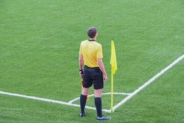 Referee from the sidelines of a soccer game.