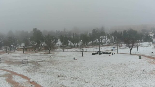 Jerusalem Park (gan sacher) in the snow aerial view, morning
People having fun in thw snow Jerusalem, aerial view

