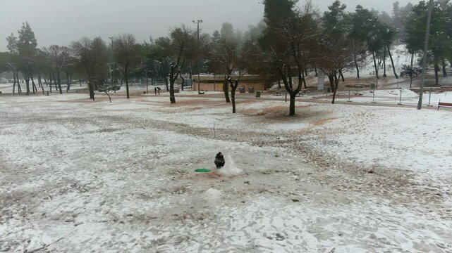Jerusalem Park (gan sacher) in the snow aerial view, morning
People having fun in thw snow Jerusalem, aerial view
