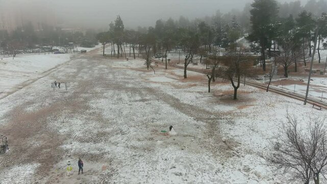 Jerusalem Park (gan sacher) in the snow aerial view, morning
People having fun in thw snow Jerusalem, aerial view
