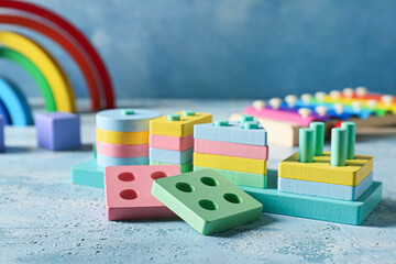 Children building blocks on blue background