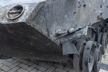 Bullet holes in Rusty russian tank burned by the Ukrainian military during Russian invasion of Ukraine in 2022. Downtown of Kyiv, capital of Ukraine.