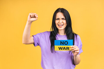 Stop war in Ukraine! Portrait of sad agressive angry woman holding in hands Ukrainian flag isolated...