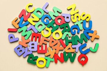Colorful letters on beige background. Alphabet concept