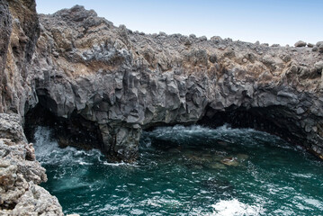 View of the vast lava fields and boiling waters of Los Hervideros, Lanzarote, Canary Islands, Spain.