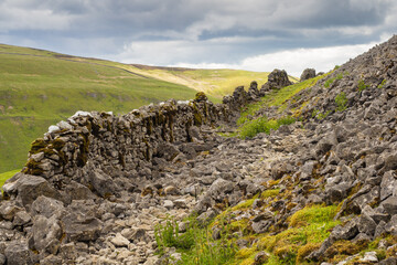 On the Coast to Coast long distance footpath walk at Muker in Swaledale in the Yorkshire Dales