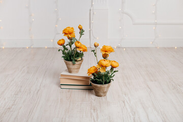 artificial yellow flowers in a beautiful pot. Spring composition.