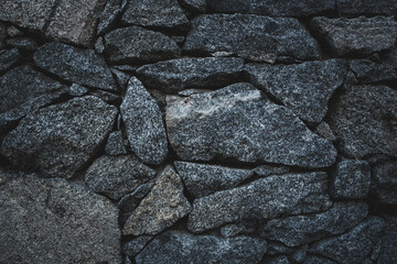 Brick Silver Wall. Abstract texture. Rock background. Rock texture. Black texture. Dark marble. Stone background. Rock pile. Paint spots. Rock surface with cracks. Grunge Rough structure.