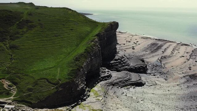 Aerial view of MonkNash Coast known as the Jurassic coast in South Wales uk. View of beach from a drone above during summer time