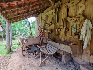 Fototapeta na wymiar Old farm tools in a barn in southern Brazil