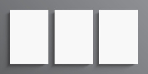 3 blank white paper posters hanging on grey wall background. Poster gallery vector mockup for art, image, or text placement.