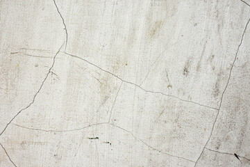 Old white concrete wall with stains and cracks, old concrete for background.