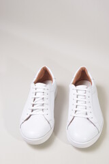 white leather sneakers isolated on white background