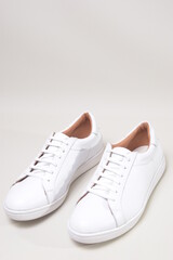 white leather sneakers isolated on white background