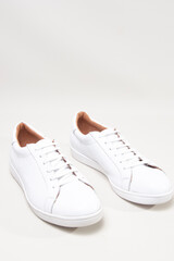 white leather sneakers isolated on white background
