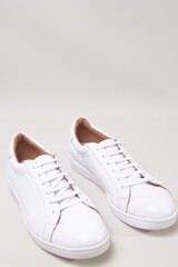 white leather sneakers isolated on white background