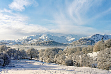 Fototapeta na wymiar Lake District National Park, Cumbria, England, UK. Winter landscape. S.W. over Langdale to Wetherlam mountain from Loughrigg
