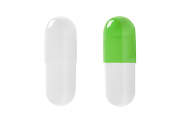 Green and white pills capsule isolated on white background.