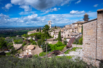 Panorama of the ancient houses of the city of Assisi (Umbria Region, central Italy). Is world famous as birthplace of St. Francis, Italy's christian Patron. - obrazy, fototapety, plakaty