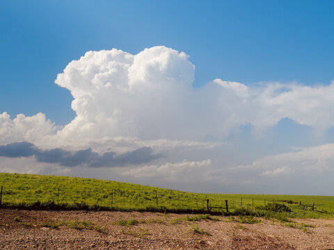 Towering cumulus (pre-thunderstorm stage) clouds over the Flint Hills of Kansas. 