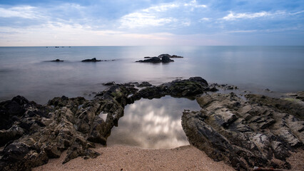 View of a rocky coast during sunset. Long exposure shot.sea beach landscape