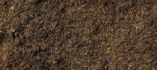 Soil for planting. Rice husk mixed with soil and manure. Soil preparation for agriculture.