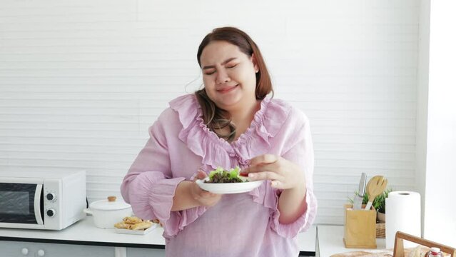 Unhappy Fat woman preparing salads for dieting weight loss. 