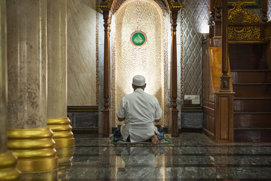 muslim man praying in mosque during ramadan period