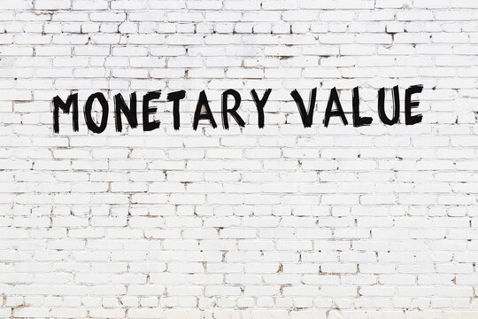 White wall with black paint inscription monetary value on it