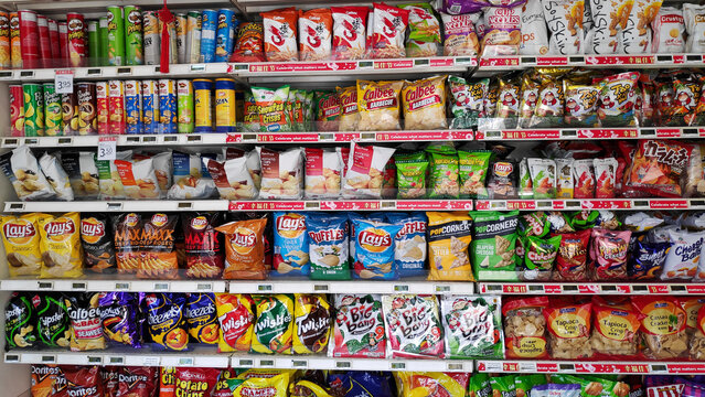 Various of snack sold on the rack in Singapore.